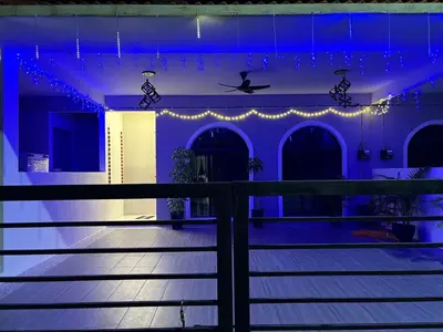 a house with lights on the front of it at Luxury House Panoramic Views and Elegant Comfort in Batu Gajah