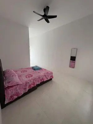 a bedroom with a bed and a ceiling fan at Luxury House Panoramic Views and Elegant Comfort in Batu Gajah