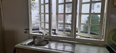a sink in a kitchen with a window at B43A2 Silverpark Resort Best Mountain view Walk up 1 floor in Bukit Fraser