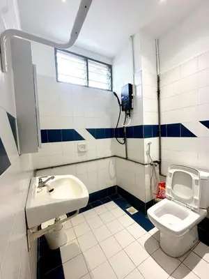 a bathroom with a sink and a toilet at Bagan Cozy Family Retreat 4BR 10 Pax in Butterworth