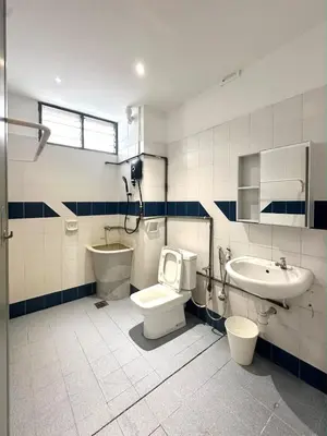 a bathroom with a toilet and a sink and a shower at Bagan Cozy Family Retreat 4BR 10 Pax in Butterworth