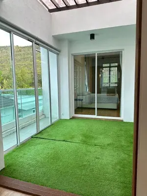a living room with a green rug on the floor at 5 Rooms Semi D in Golden Hills - Lena Home in Brinchang
