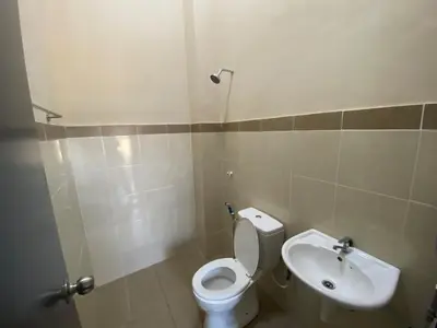 a bathroom with a toilet and a sink at TheBunga Homestay w Private Pool&Karaoke -Tronoh Perak in Teronoh