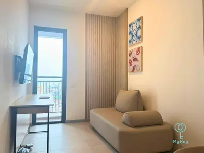 a living room with a couch and a table and a window at 22 Macalisterz by Mana Mana in George Town