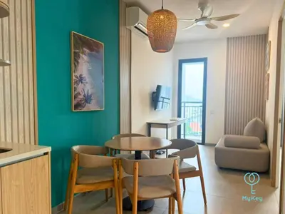 a kitchen and dining room with a table and chairs at 22 Macalisterz by Mana Mana in George Town