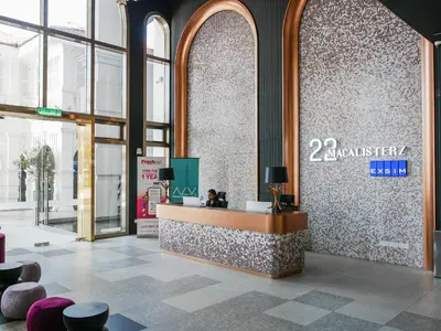 a lobby with a reception desk in a building at 22 Macalisterz by Mana Mana in George Town