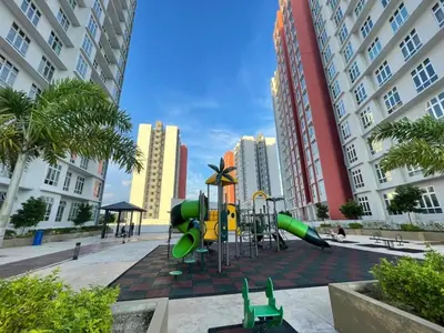 a playground in the middle of a city with tall buildings at Anderson Apartment by LUMO LIMA in Ipoh