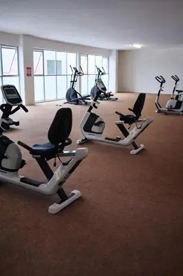a row of exercise bikes in a gym at Anderson Apartment by LUMO LIMA in Ipoh