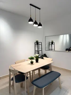 a dining room with a table and two chairs at Cameron Jaya Homestay 8pax in Tanah Rata