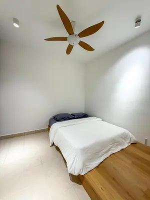 a bedroom with a bed with a ceiling fan at Cameron Jaya Homestay 8pax in Tanah Rata
