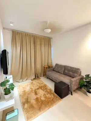 a living room with a couch and a rug at Cameron Jaya Homestay 8pax in Tanah Rata