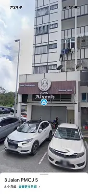 two cars parked in a parking lot in front of a building at Cameron Jaya Homestay 8pax in Tanah Rata