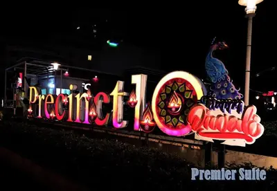 a neon sign for a parrot restaurant at night at Premier Suite Seaview 3 minute to gurney in Gua Sai