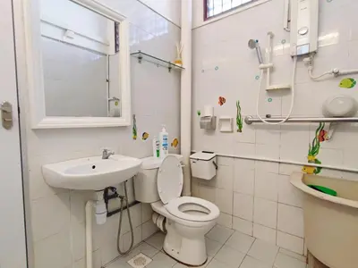 a small bathroom with a toilet and a sink at Cozy Home near Airport, & Bayan Lepas Industrial in Bayan Lepas