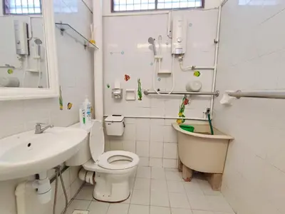 a bathroom with a toilet and a sink and a tub at Cozy Home near Airport, & Bayan Lepas Industrial in Bayan Lepas