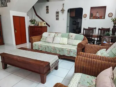 a living room with two couches and a coffee table at Cozy Home near Airport, & Bayan Lepas Industrial in Bayan Lepas
