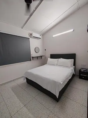 a bedroom with a bed and a chalkboard on the wall at Tambun - Near LWOT, PLUS Highway Access ,Sunway & Pantai Hosp in Tambun