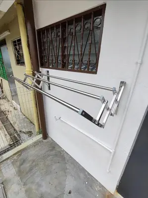 a set of metal handrails on the side of a building at Tambun - Near LWOT, PLUS Highway Access ,Sunway & Pantai Hosp in Tambun