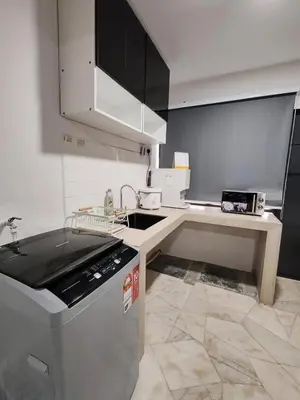 a small kitchen with a sink and a dishwasher at Tambun - Near LWOT, PLUS Highway Access ,Sunway & Pantai Hosp in Tambun