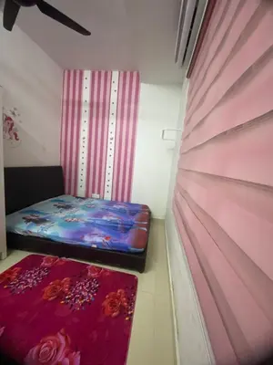 a small room with two beds and a curtain at Teratak Nufal Homestay