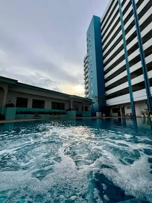 a pool of water in front of a building at Seaview mutiara melaka Pantai puteri in Gua Sai