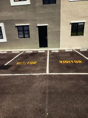 an empty parking lot in front of a building at IFS Soho 3 Basic Home in Seri Iskandar