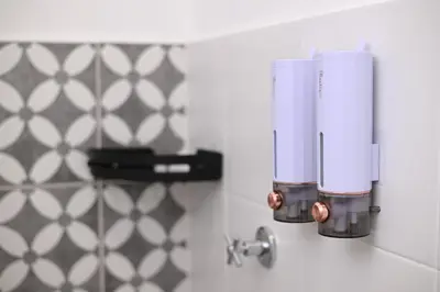 a kitchen with a food processor on a wall at Yeop & Chor Homestay in Seri Iskandar