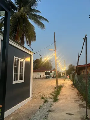 a building on the side of a beach with a street at TeeDo Zzz in Parit Buntar