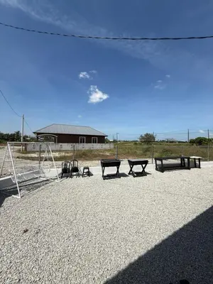 a group of picnic tables in a park at Adlisem Homestay in Kampong Lahar Yooi