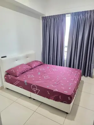 a bedroom with a bed with pink sheets and a window at 3BR Condo near Queensbay, Penang in Bayan Lepas