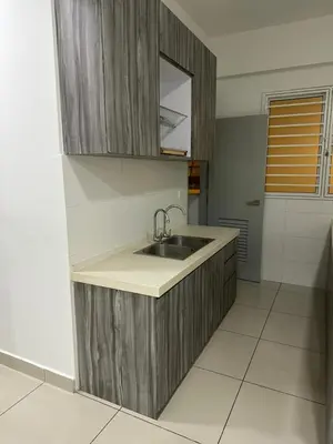 a kitchen with a sink and a mirror at 3BR Condo near Queensbay, Penang in Bayan Lepas