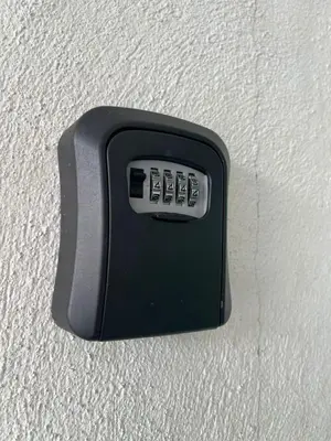 a black switch on a white wall at Izzu Homestay Sungkai in Sungkai