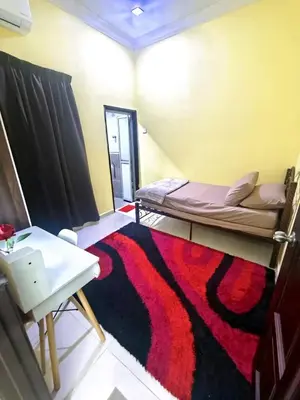 a room with two bunk beds and a rug at Dreamy Stay Penang in Butterworth