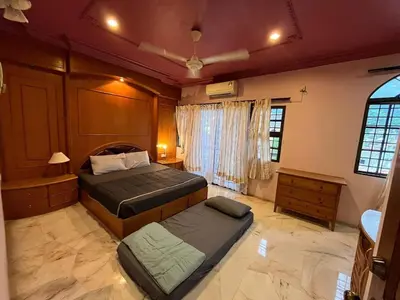 a bedroom with two beds in a room at Garden vibe STAYcation Hillside in Ipoh