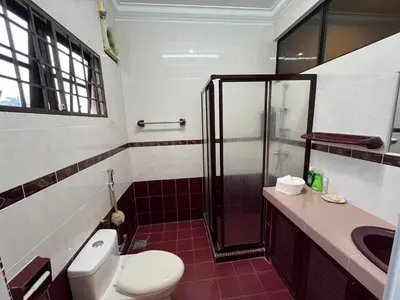 a bathroom with a toilet and a shower and a sink at Garden vibe STAYcation Hillside in Ipoh