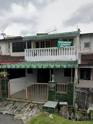 an old house with a balcony on top of it at Aishah homestay in Ipoh