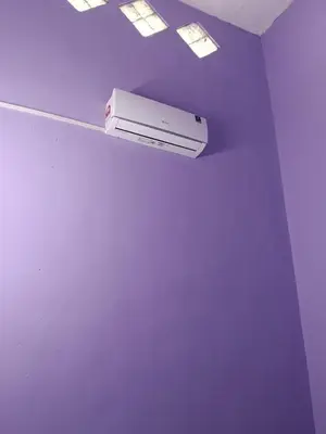 a room with a white object on the ceiling at Homestay Sayang in Ipoh