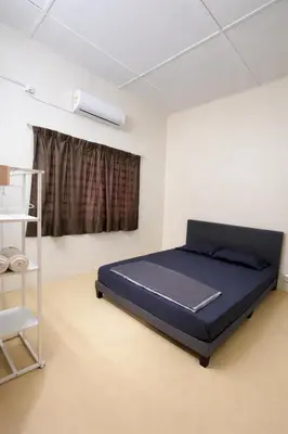 a bedroom with a blue bed in a room at 525A Homestay Malim Nawar in Malim Nawar
