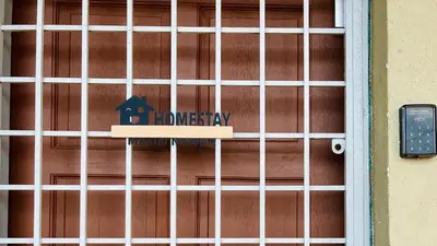 a door with a sign that reads had therapy at 525A Homestay Malim Nawar in Malim Nawar