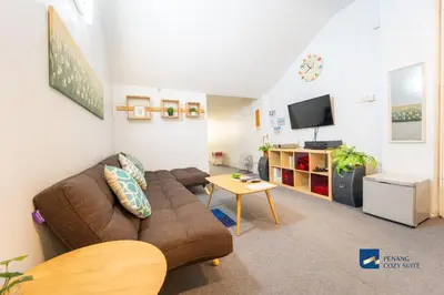 a living room with a couch and a tv at Cozy Nanny House 2-6Pax #Georgetown #Hameediyah in George Town
