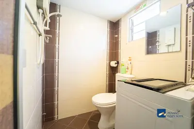a bathroom with a toilet and a sink and a mirror at Cozy Nanny House 2-6Pax #Georgetown #Hameediyah in George Town