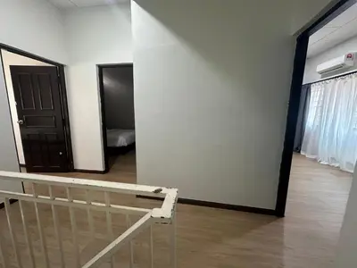 a room with a bed and a black door at MRB Homestay in Ipoh