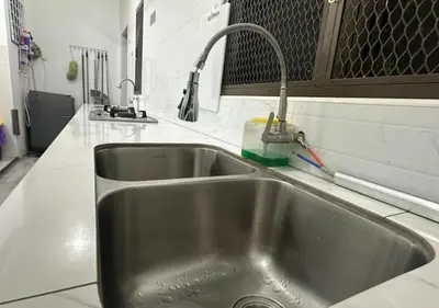 a stainless steel sink in a kitchen at MRB Homestay in Ipoh