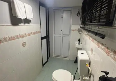 a bathroom with a toilet and a sink at MRB Homestay in Ipoh