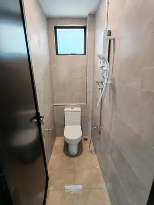a small bathroom with a toilet and a window at Pets Friendly Hometstay at Georgetown Heritage in George Town