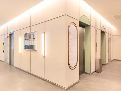 a hallway with doors and a sign on a wall at 22 Macalisterz - King Suite - 65