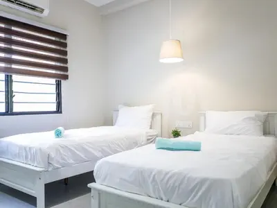 two white beds in a room with a window at Cozy Corner PataniRoad 14 pax Georgetown in George Town