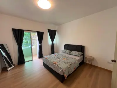 a bedroom with a bed and a large window at Rumah by Abg K in Cameron Highlands in Tanah Rata