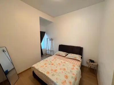 a small bedroom with a bed and a mirror at Rumah by Abg K in Cameron Highlands in Tanah Rata