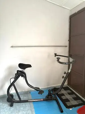 a exercise bike in front of a white wall at Budi Homestay Taman Jati in Ipoh